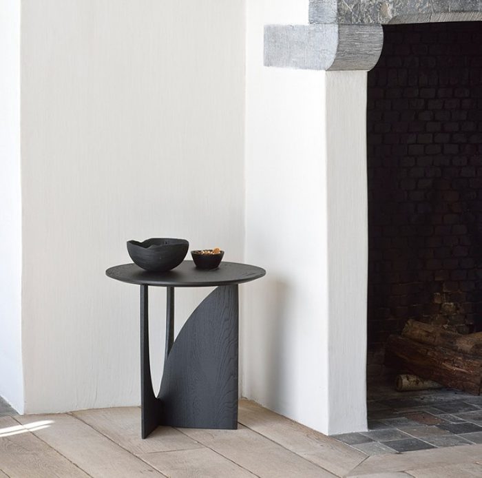 dark wood side table in minimalist living room